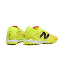 Chuteira Society TF New Balance Tekela Elite V5 Amarela e Laranja