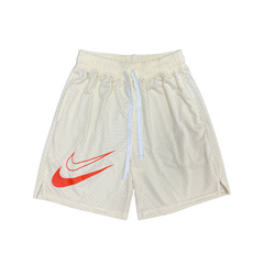 Pantalones cortos Nike en color beige y rojo