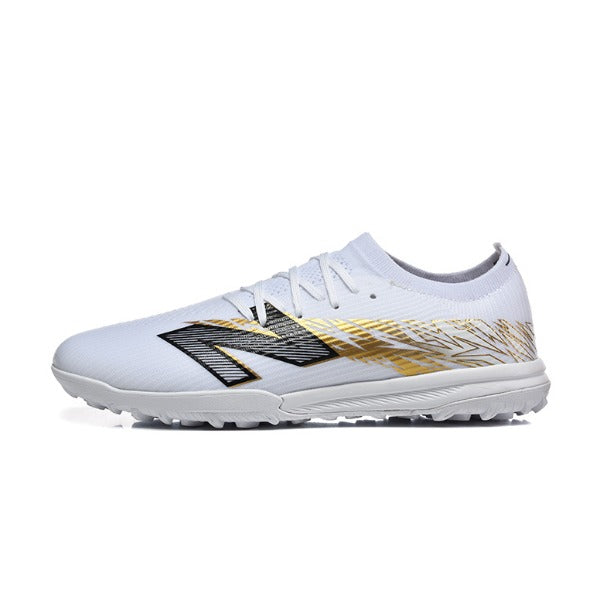 Chuteira Society TF New Balance Furon V8 Elite Branca e Dourada