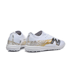 Chuteira Society TF New Balance Furon V8 Elite Branca e Dourada