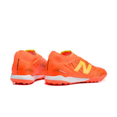 Chuteira Society TF New Balance Tekela Elite V5 Laranja